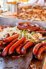Italian Sausages Cooking at an Outdoor Food Event