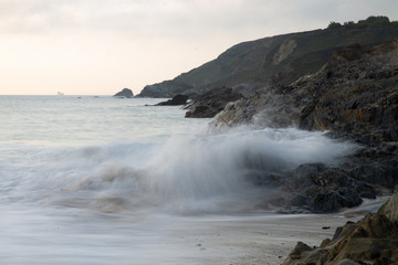 Waves crashing on rock