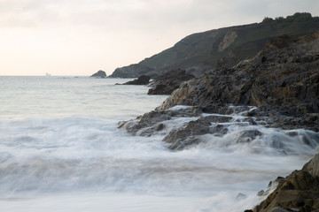 Waves crashing on rock