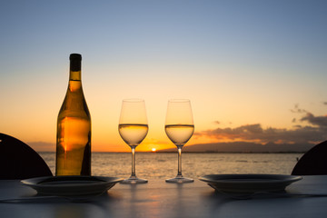 Romantic dinner table setting by the sea. 