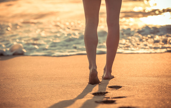 Closeup Of Feet Walking Down The Beach. Beach Vacation Holiday Concept. 