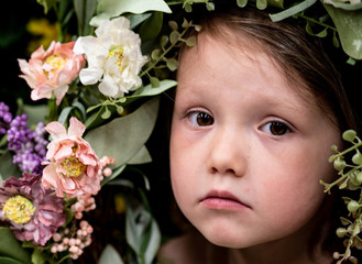 Sad Little Girl Child in Floral Garden Setting Portrait
