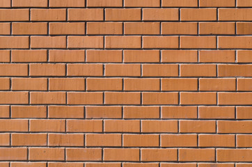 textured decorative orange brick wall. background, architecture.