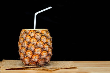 pineapple juice on wooden table.