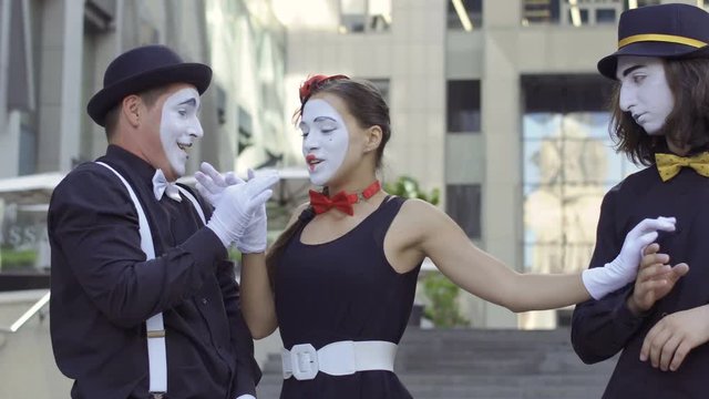 Two mimes try to fall in love in each other pretty girl