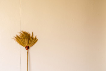 Hand made broom on the old background