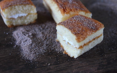 fresh sweet homemade delicious cake on wooden background