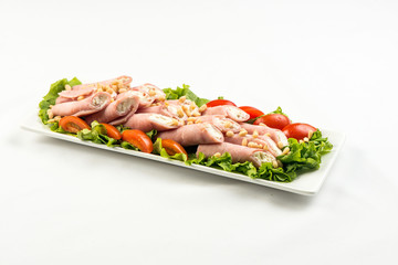 meat rolls with ham, cheese and greens, on white background