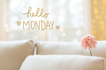Hello Monday message with a flower in a bright interior room sofa