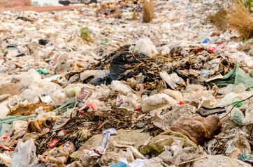 RATCHABURI PROVINCE, THAILAND-MARCH 18: People working in Municipal waste disposal open dump process.  Dump site at Ratchaburi Province on MARCH 18 , 2016 in RATCHABURI PROVINCE THAILAND