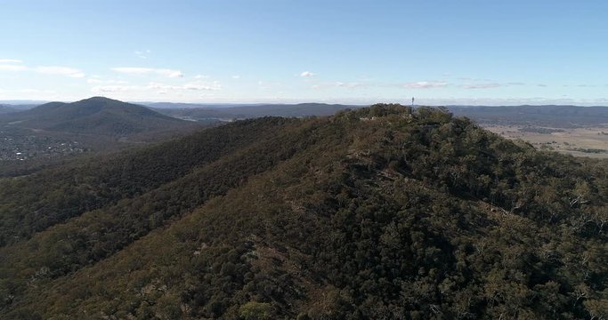 The top of the hill &ndash; Mount Ainslie in Canberra city of Australia &ndash; elevated observation point and tourist destination covered by evergreen gumtrees.
