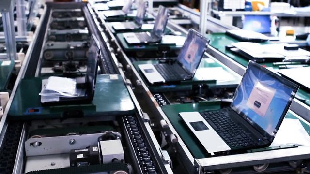 Conveyor Belt On the Assembly Line of a Computer Factory. Blue Steel Tone.