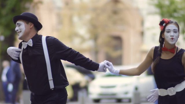 Handsome man mime invite his girlfriend on the date
