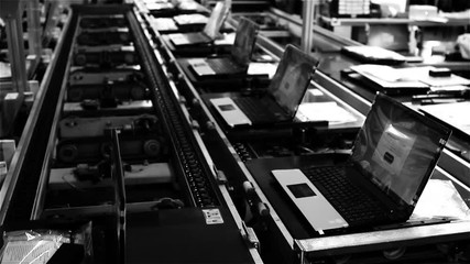 Assembly Line On the Laptop Factory. Black and White Tone. Fast Motion Shot.