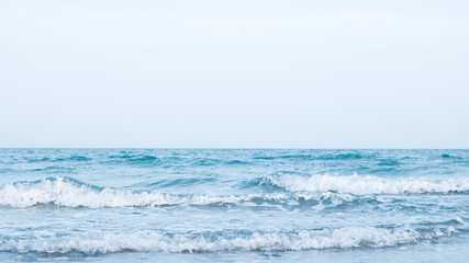 Naklejka na ściany i meble blue soft wave with clean ocean . sun light on sea . travel to the beach on summer holiday .