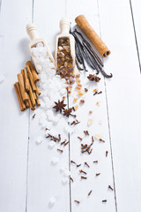 sugar variations with cinnamon and vanilla on white wood table background