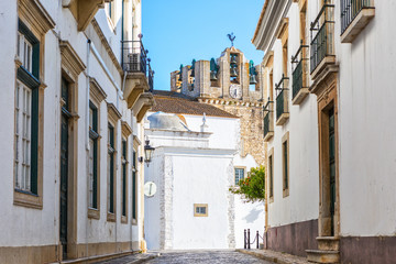 Fototapeta na wymiar Narrow street in historic old town Faro, Algarve, Portugal.