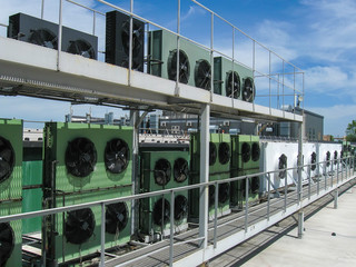 Large industrial power fans on the roof of the building. Hot air cooling