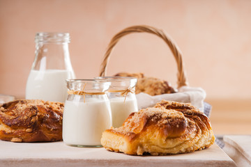 Bread buns and jars with milk 