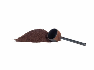 Isolated pile of ground coffee with scoop