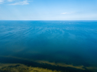 drone image. aerial view of Baltic sea shore with rocks and forest on land