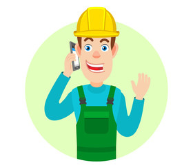 Builder talking on mobile phone and raised a hand in greeting