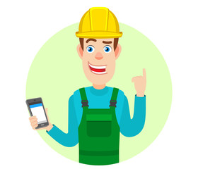 Builder with mobile phone and pointing up