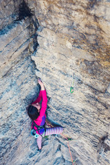 Fototapeta premium The woman is on a rock.