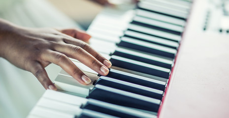 Close-Up a black woman hands playing on piano
