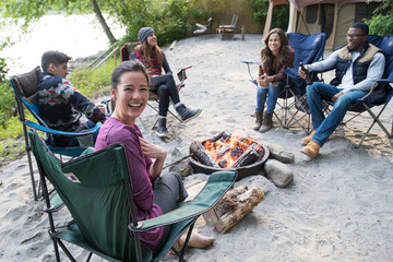 Group of friends camping outside in nature