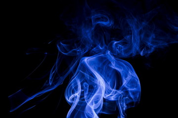 Fototapeta premium Blue smoke on black background