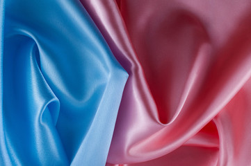 Abstract silk luxury background, piece of cloth, light pink and light blue cloth texture.