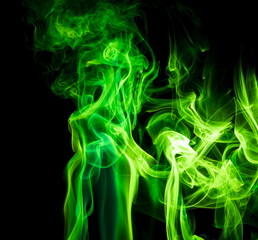 Obraz premium Green smoke on black background