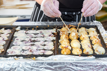 Process to Cooking Takoyaki on hot pan Famous food Osaka Japan street food