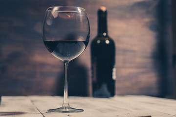 bottle and glass with red wine