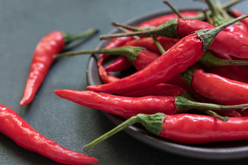 Chili in a bowl on a gray background close up