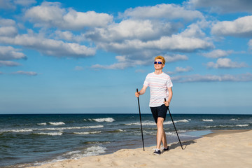 Nordic walking - man working on beach