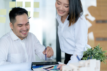 Business partners showing team work while working in meeting room at office interior Business consultant concept. Team work and successful project.