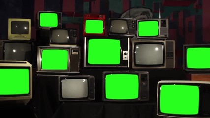 Many Tvs with Green Screens Turning Off. Zoom Out. Aesthetics of the 80s. Ready to Replace Green Screens with Any Footage or Picture you Want. 