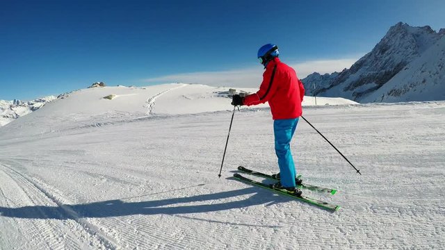 Man skiing on the prepared slope with fresh new powder snow in Rhaetian Alps
, Adamello, Tonale, Italy