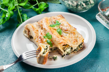 Portion of cannelloni stuffed with spinach