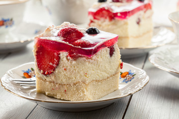 Cheesecake with strawberries, blueberry and jelly