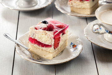 Cheesecake with strawberries, blueberry and jelly