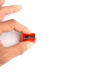 pencil sharpener and pencil on white background.