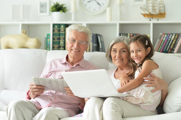 senior couple with granddaughter