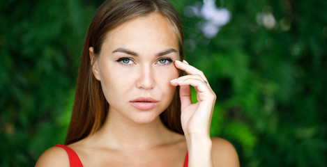 close-up portrait of young lady outdoors