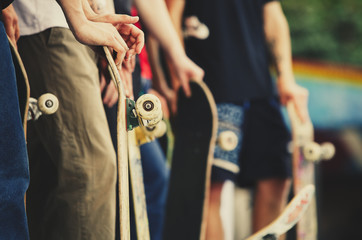 Group of skater boys compete in skate contest outdoor