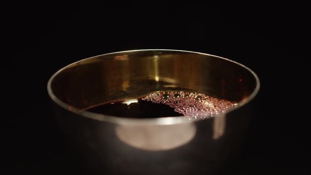 Focus across chalice of wine 