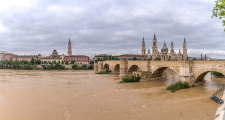Fototapeta premium Basilica Cathedral Pilar Zaragoza Aragon Spain, water Ebro river stone bridge