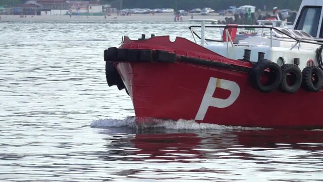 Close up of Pilot boat in the harbour. Going to meet a cargo ship. Slow motion 240 fps
